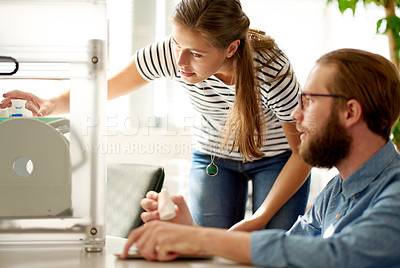 Buy stock photo Creative, people or working with 3D printer for project, prototype or design at office desk. Man, woman or designers with mold on machine for manufacturing or product production together at workplace