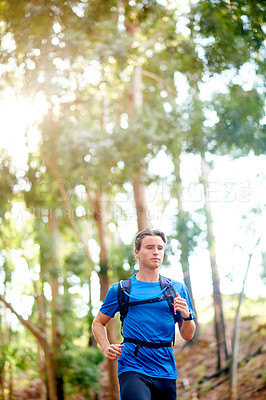 Buy stock photo Running, fitness and man in woods, training and exercise with challenge, endurance and wellness. Healthy person, athlete and runner in forest, countryside and energy with practice, cardio and workout