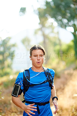 Buy stock photo Outdoor, man and music with running for fitness, breathing and runner with training for marathon. Nature, male person and athlete with hydration pack for wellness, endurance and earphones for workout
