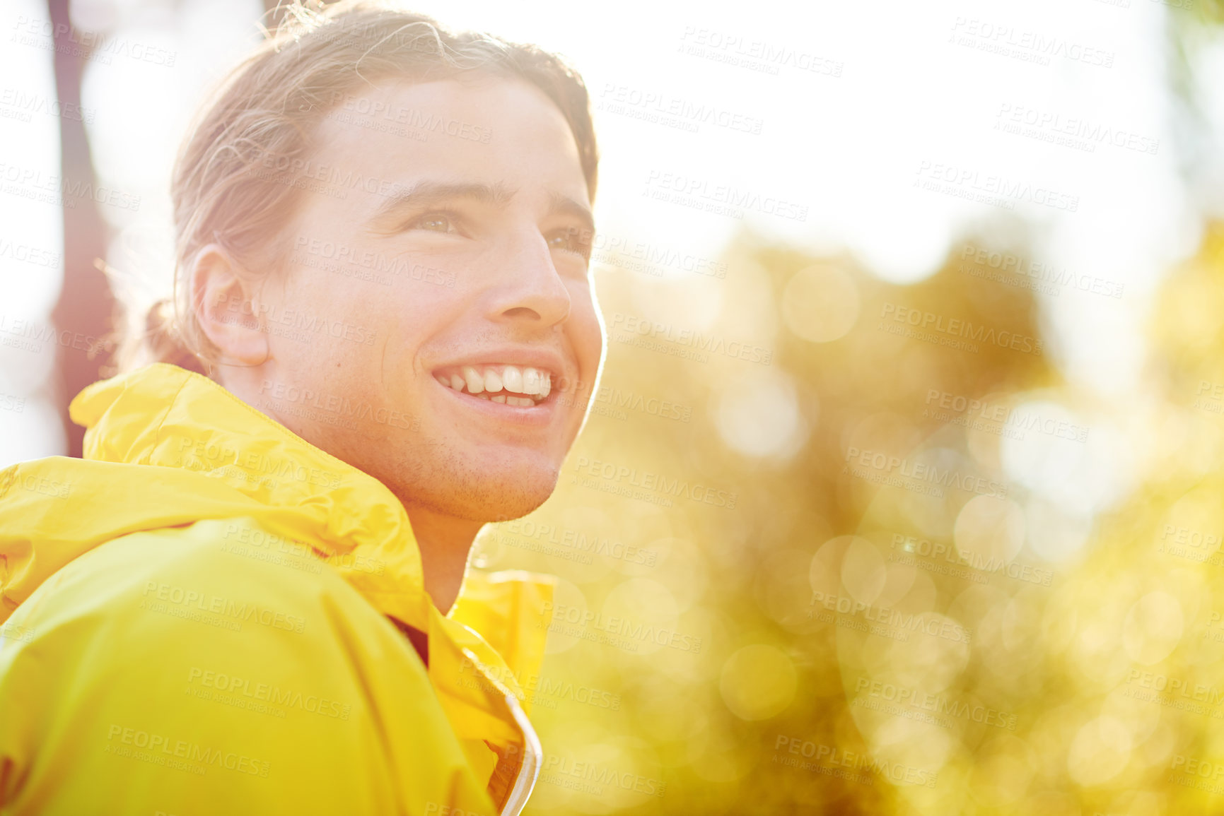 Buy stock photo Outdoor, raincoat and man with smile for hiking, trail adventure and thinking on break by bokeh. Nature, male person and hiker with happiness for fitness, trekking and wellness with positive thoughts