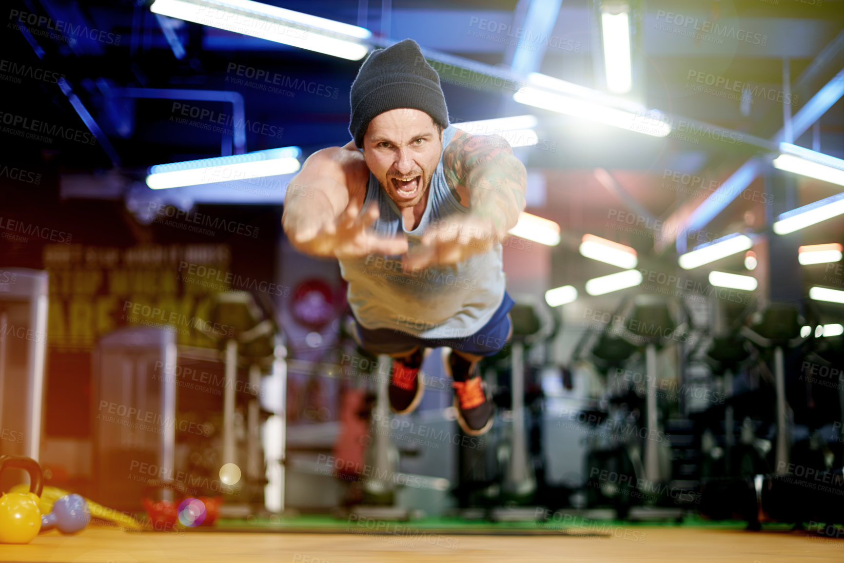 Buy stock photo Jump, fly and man in fitness for push up, workout and exercise for gym, health and strong core. Intensity, air and athlete training on floor in studio for callisthenics, portrait or acrobatics skills