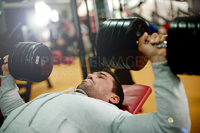 Buy stock photo Man, dumbbell and bench press at gym, workout and muscle development for chest at club. Person, bodybuilder and weightlifting challenge with equipment, power or strong with wellness at fitness center