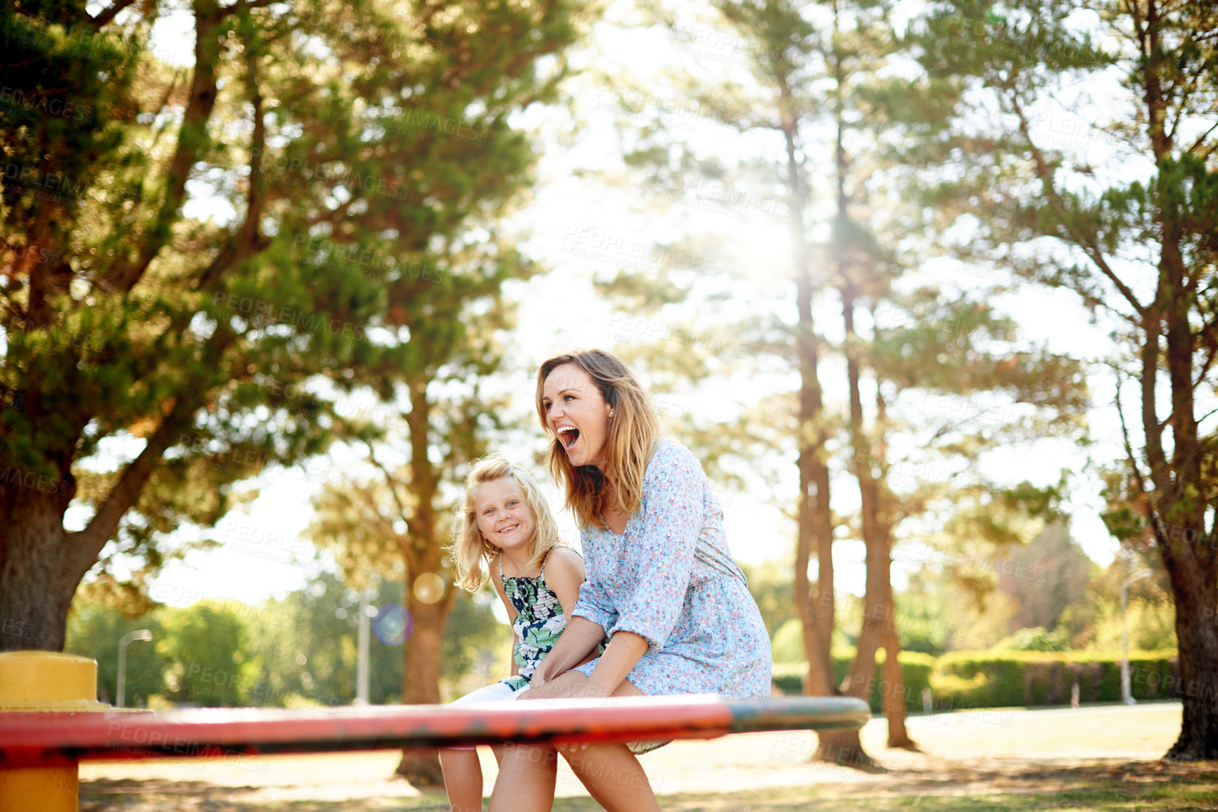Buy stock photo Happy, mother and child on carousel at playground for holiday fun, playing games and bonding together. Smile, family and kid on merry go round for spinning ride, activity and balance on vacation