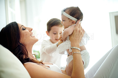 Buy stock photo Bed, love or smile with baby and mother in home together for bonding, family time or relationship. Growth, maternity or security with boy, girl and woman in bedroom of apartment for morning wellness