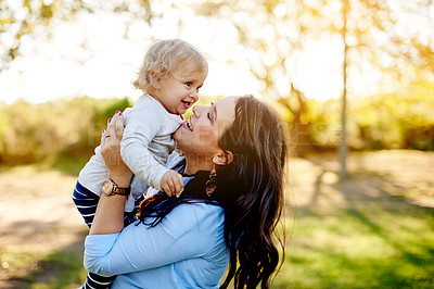 Buy stock photo Outdoor, park and mother with child for carrying, relationship and connection together with smile. Happy family, mom and girl with love for bonding, caring and trust on weekend holiday in nature