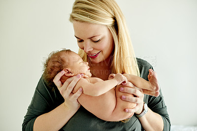 Buy stock photo Relax, smile and mother with baby in home for bonding, care and family time in living room together. Happy, security and newborn child with mom in lounge for support, safety and protection in house.