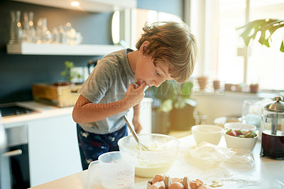 Buy stock photo Baking, ingredients and child in kitchen in home with learning, fun and activity on holiday. Tasting, mixture and boy kid with cooking recipe for morning pancakes with weekend hobby in house.