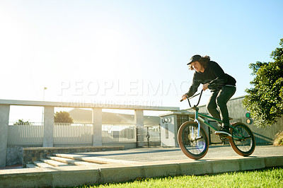 Buy stock photo BMX, man and bicycle in city for cycling, urban challenge and exercise with mockup space. Person, riding bike and cyclist on curb outdoor for fitness, extreme sports or action for balance with cardio