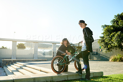 Buy stock photo Men, bicycle and blue sky with urban park for extreme cycling, sport or commute in city. Male people, friends or cyclist with bike or stairs for sustainable challenge or carbon footprint on space