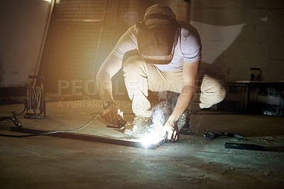 Buy stock photo Metalwork, sparks and welding with man in workshop for manufacturing or production process. Design, engineering and industry with freelance person in garage for expertise or small business startup