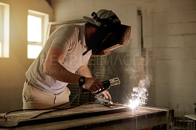 Buy stock photo Industry, sparks and welding with man in workshop for manufacturing or production process. Design, engineering and metalwork with freelance person in garage for expertise or small business startup