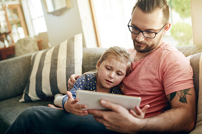 Buy stock photo Family, dad and child with tablet, lounge and watching movie with subscription on website and relax. Online, man and streaming cartoons with daughter, bonding and entertainment with tech in house