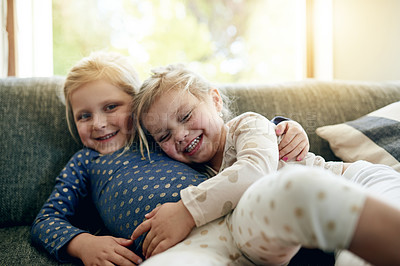 Buy stock photo Bonding, hug and smile of girl children on sofa in living room of home together for morning love. Family, flare and portrait with happy sister kids embracing in apartment for development or growth