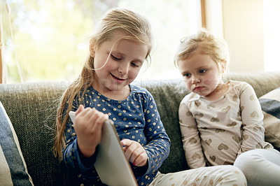 Buy stock photo Tablet, relax and kids on sofa in home for playing educational game on app for learning. Digital technology, bonding and girl children with online entertainment together in living room at house.