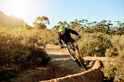 Buy stock photo Man, cyclist and mountain bike with adrenaline rush on dirt road for fitness or extreme sport in nature. Male person, bicycle and cycling with helmet for cardio workout on path or natural trail