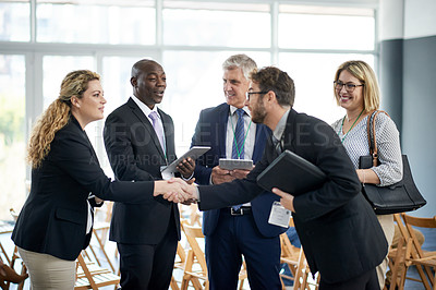 Buy stock photo Businessman, tablet and shaking hands for networking at conference with app, introduction and woman at meeting. People, exchange contact and tech for hello, smile or group at international convention