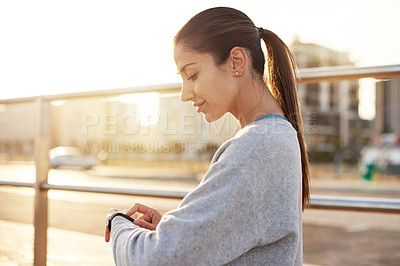 Buy stock photo Fitness, exercise and woman with smart watch, city and timer for tracking time of workout, online and outdoor. Morning, digital and person with app for routine, healthy or update of tech for practice