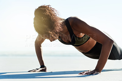 Buy stock photo Fitness, power and push up with woman on beach for balance, physical challenge or workout. Concentration, exercise and performance with African athlete on sky for improvement or strength training