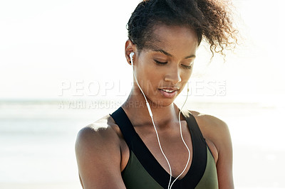 Buy stock photo Thinking, fitness and woman with earphones, beach and music for training routine, athlete and break. Outdoor, runner and black person with tech for audio, reflection and workout with song in nature