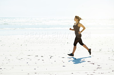 Buy stock photo Fitness, woman and running at beach for wellness, cardio and exercise for training in body care. Athlete, active and runner at ocean with energy, healthy hobby and mockup space for muscle development