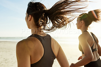 Buy stock photo Cardio, women and running at beach with workout, exercise in training for marathon and health benefits. Back, athlete and runners at ocean with fitness, personal trainer and commitment for wellness.