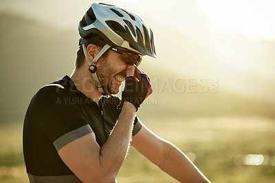 Buy stock photo Man, cyclist and allergies with headache, stress and nasal congestion with pollen in countryside. Person, pain and airway inflammation with helmet for safety, space or triathlon training in Germany