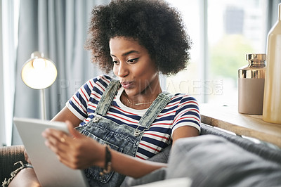 Buy stock photo Relax, social media and tablet with woman on sofa in living room of home for online post or update. App, browsing and internet with happy African person in apartment for download or web chat