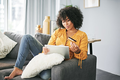 Buy stock photo Woman, tablet and credit card in home for ecommerce, bills and discount sale on web on sofa. Person, smile and relax on couch for fintech app with budget, online shopping or easy payment at apartment