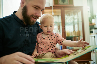 Buy stock photo Father, baby and reading book in a family home living room for development. Happy man or father with toddler kid for quality time, love and care or learning, talking and together for picture story