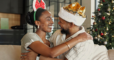 Buy stock photo Christmas, love or black couple with hug for festive celebration or holiday together in home. Man, woman or thank you with smile, embrace or comfort for December, Santa weekend or vacation in house