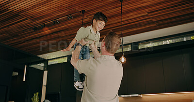 Buy stock photo Father, love and lift child in home with support, quality time and bonding together with smile. Happy boy, dad and play flying game in family house with care, trust or security with parent connection