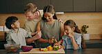 Parents, cooking and laughing with children, kitchen and helping mom with vegetables and bonding. Learning, recipe and happy people with kids, love and meal prep with family or connection in house