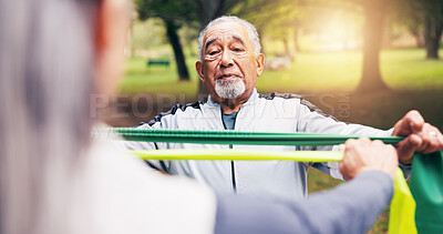 Buy stock photo Old man, stretching and band at park for yoga, exercise and physio training for healthy lifestyle. Senior people, guidance and warm up in nature for physiotherapy, pilates workout and wellness hobby