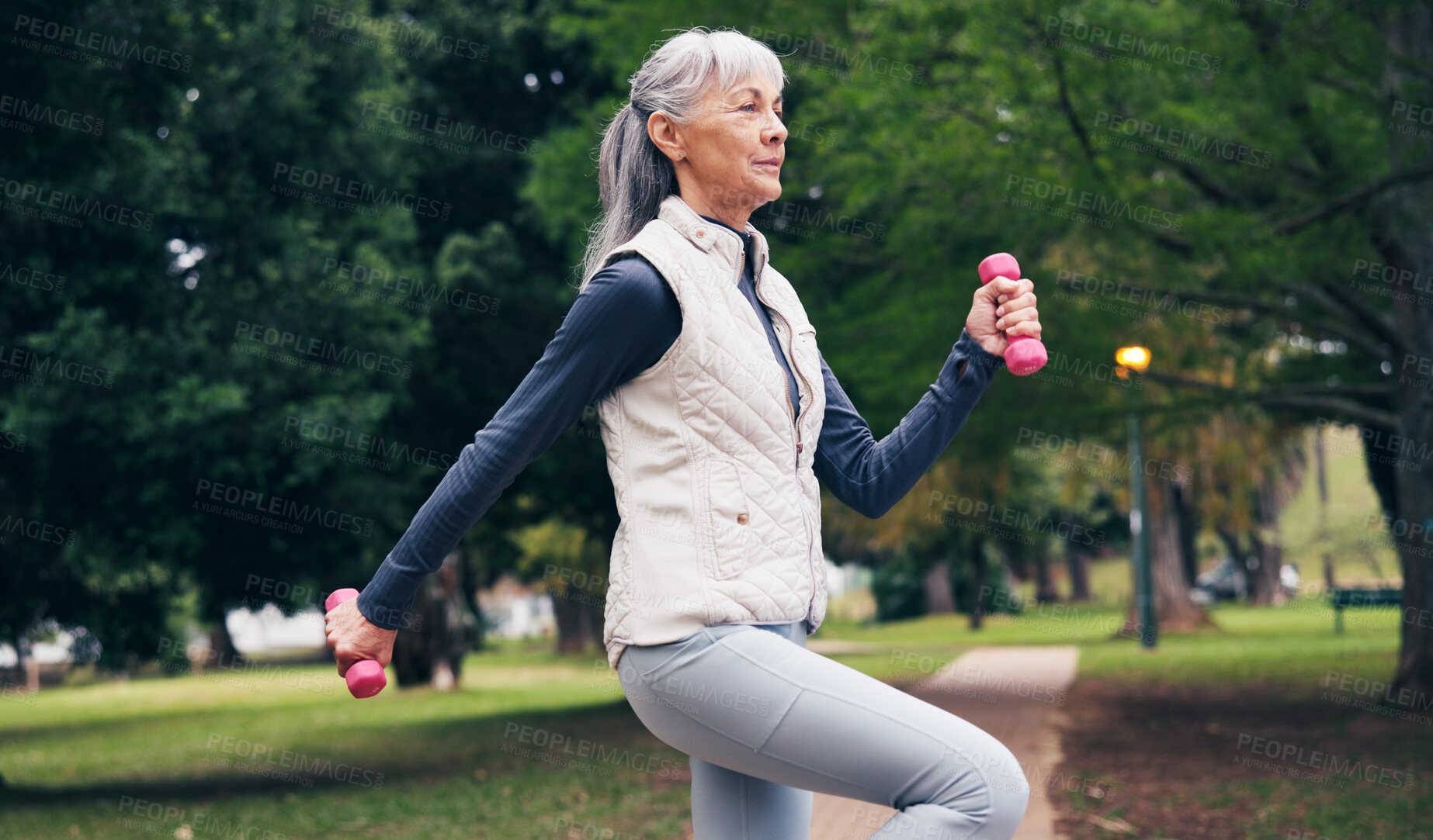 Buy stock photo Outdoor, fitness and senior woman with dumbbells, endurance or workout routine for health in nature. Park, wellness and retired person with equipment for exercise, training and physical activity