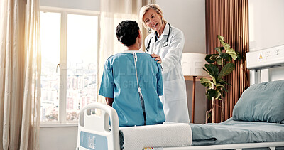 Buy stock photo Happy, doctor and woman in hospital with support, speaking and good news for breast cancer remission. Medical worker, mature person and discussion in clinic with smile, disease recovery or assurance.