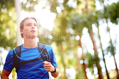 Buy stock photo Man, running and fitness in forest with training for marathon, race or triathlon competition with health. Runner, exercise and workout in woods for cardio, sports practice and trekking in nature
