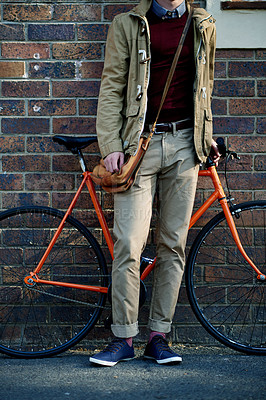 Buy stock photo Bicycle, legs and man in city on wall background for journey to college, university or school. Student, outdoor and person with bike for eco friendly transport, carbon neutral travel and commute