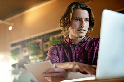 Buy stock photo Creative, employee and man with laptop, cafe and remote work for digital magazine, typing or online. Editing, article and journalist with tech for freelance project, app and story in coffee shop