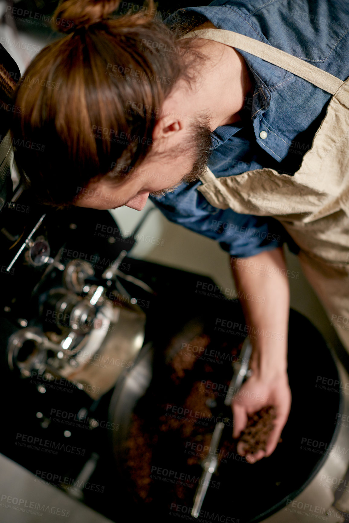 Buy stock photo Barista, man and beans in coffee roaster for production process, check quality or freshness inspection. Roasting, person and caffeine preparation with machine for test in cafe or above small business
