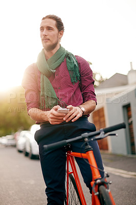 Buy stock photo Thinking, phone or man on bicycle in city for eco friendly transport, commute or outdoor travel. Entrepreneur, texting or designer in urban town with location, mobile app or bike for online address