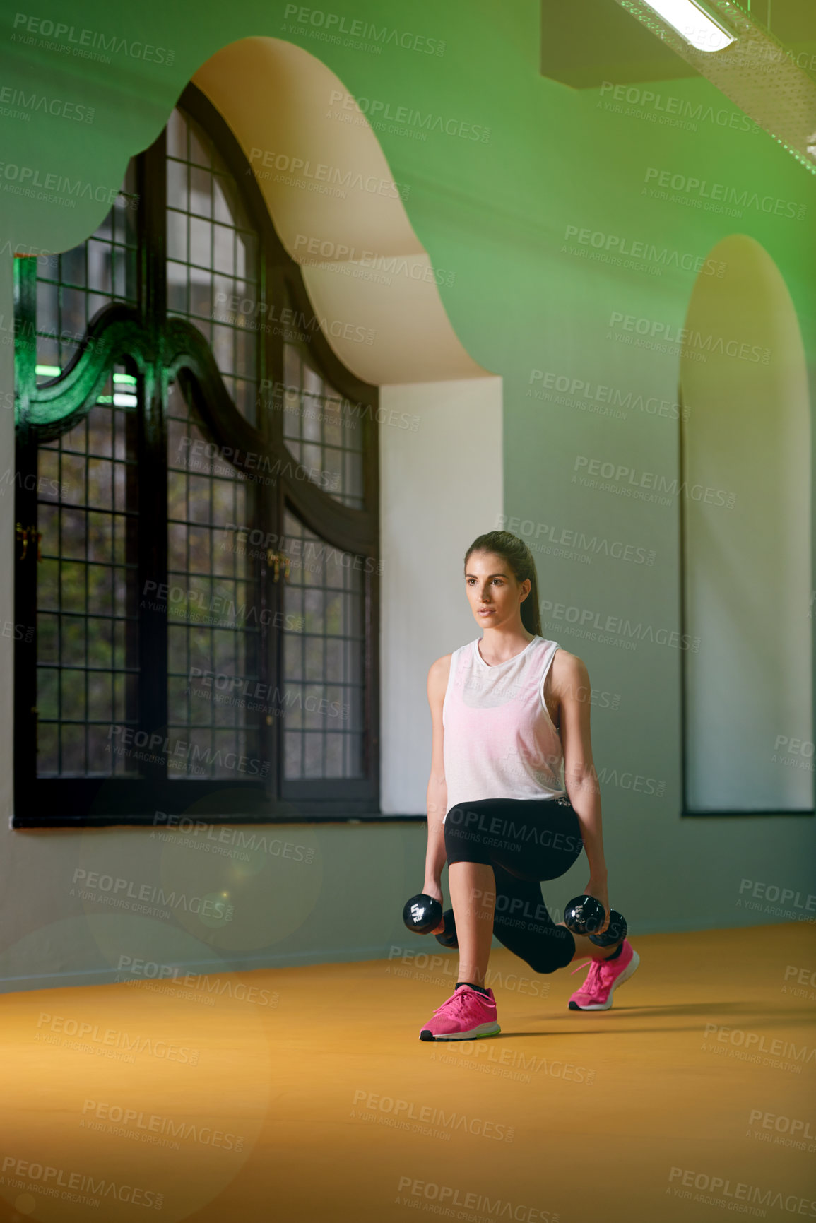 Buy stock photo Athlete, lunges and woman with dumbbells for exercise or training for wellness, body or fitness. Gym, weights or female person in health studio for cardio, sports or strong legs for workout or energy