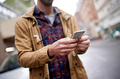 Buy stock photo Man, hands and typing with phone in city for online directions, location search and internet guide. Morning commute, person and check smartphone app for travel map, networking or social media in road
