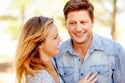 Buy stock photo Happy, outdoor and loving couple in park with sunlight, commitment and connection in peaceful nature. Smile, man and woman hug in forest with bonding, laughter and trust for relationship support.