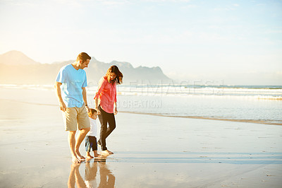 Buy stock photo Toddler, family and holding hands at the beach for bonding, together and travel in nature. People, mom and dad with boy kid, walking on shore or adventure by ocean with vacation space in Argentina