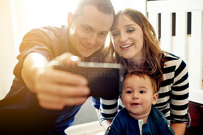 Buy stock photo Happy family, toddler and picture with selfie in home for photography, memory or bonding together. Dad, mom or people with child, boy or app for capture moment, love or childhood reminder in nursery