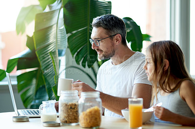 Buy stock photo Breakfast, laptop or remote work with father and daughter in dining room of home together for meal. Cereal, coffee or computer with freelance parent and girl child in apartment for bonding on weekend