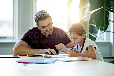 Buy stock photo Help, education and father with kid for homework in house for learning, studying or project. Smile, teaching and dad with girl child student for working on academic assignment together in apartment.