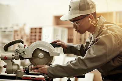 Buy stock photo Carpenter, machine or black man in workshop with chop saw, flare or angle cut for home renovation. Person, worker or craft on surface with power tool, repair or project in construction warehouse.
