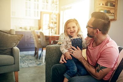Buy stock photo Smile, father and play with child on sofa for love, affection and funny games for weekend break. Portrait, man and embrace with toddler laughing for fun together, family bonding and support at house