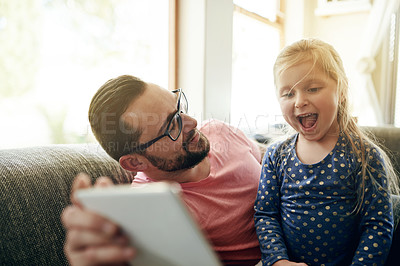 Buy stock photo Happy, man or child on couch with tablet, watching or laughing for fun educational video. Smile, father or daughter in home with technology, digital app and connection for childhood development